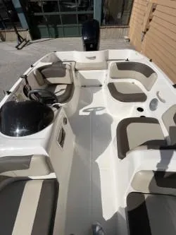 Slide: The Image of 2017 Bayliner Element E16 boat interior with seating and steering console. - 7