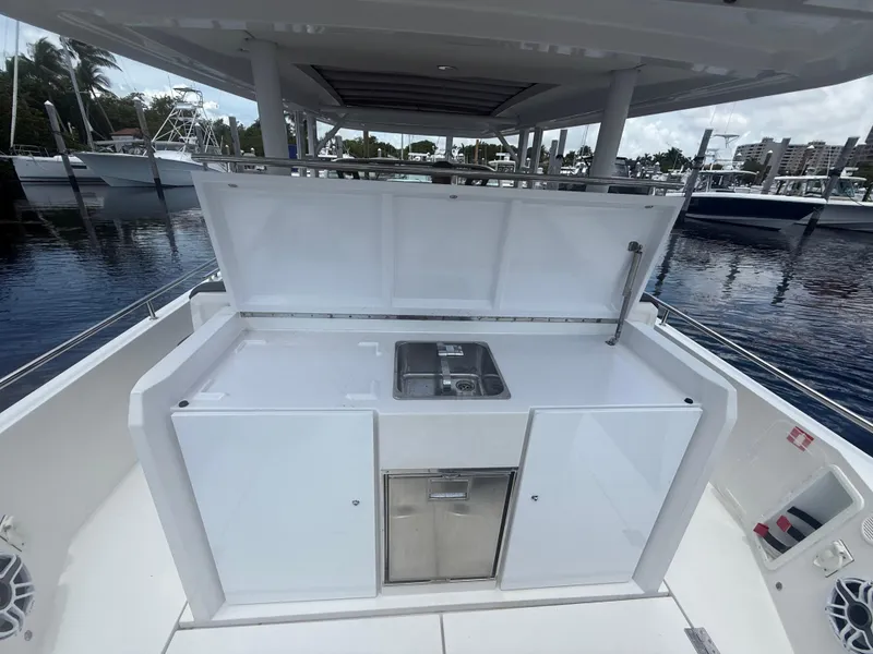 Slide: The Image of 2017 Axopar 37 Sun Top boat with open kitchenette and sink. - 11