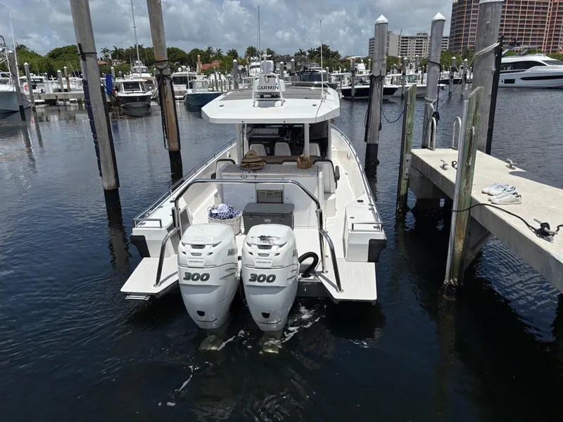 Slide: The Image of 2017 Axopar 37 Sun Top docked with twin 300 horsepower engines. - 6