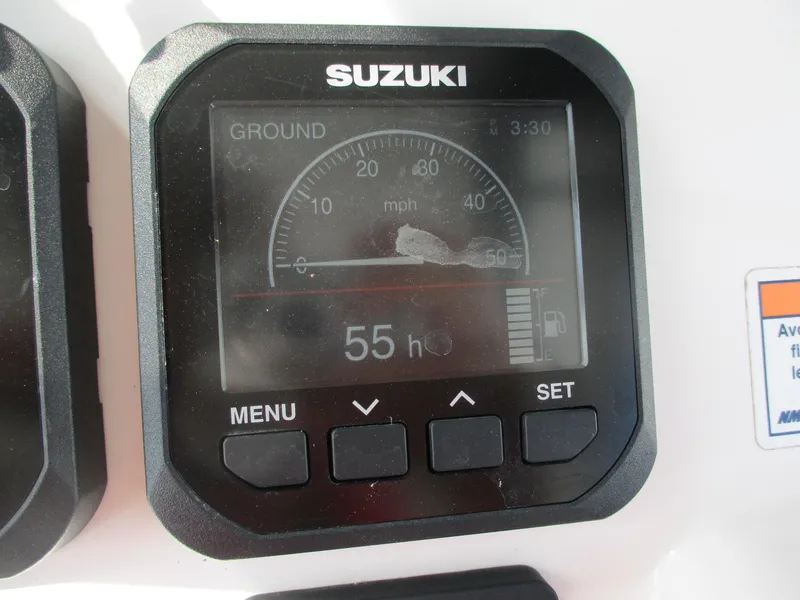 Slide: The Image of Suzuki digital gauge display on 2024 Blue Wave 2800 Makaira boat dashboard. - 11