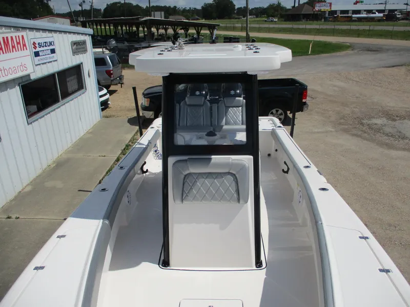 Slide: The Image of 2024 Blue Wave 2800 Makaira boat at dealership, showcasing sleek design and spacious interior. - 13