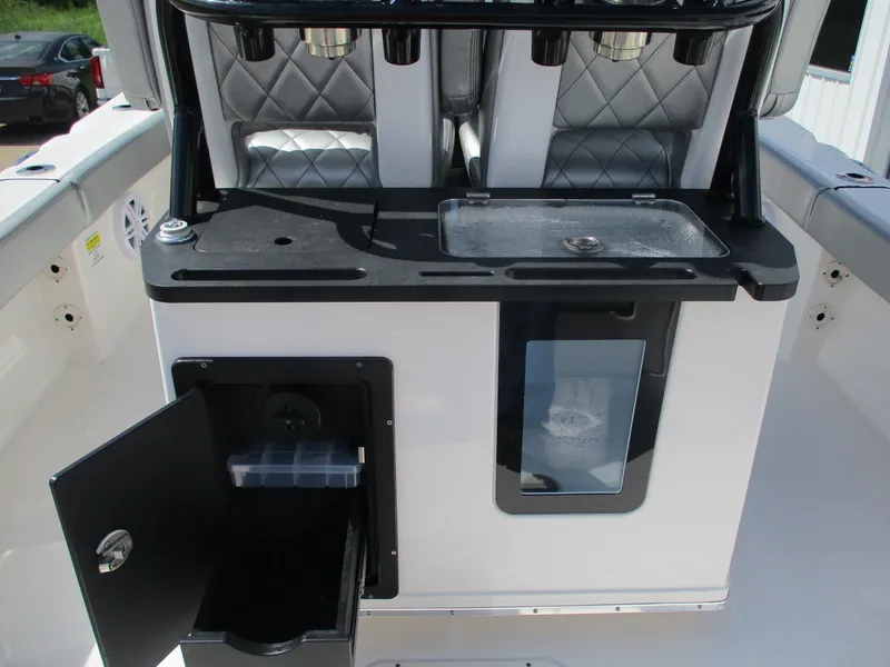 Slide: The Image of 2024 Blue Wave 2800 Makaira boat interior with storage and seating features. - 21