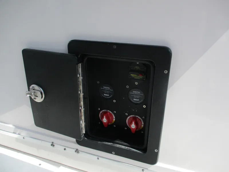 Slide: The Image of Electrical panel on 2024 Blue Wave 2800 Makaira boat, featuring digital controls and switches. - 25