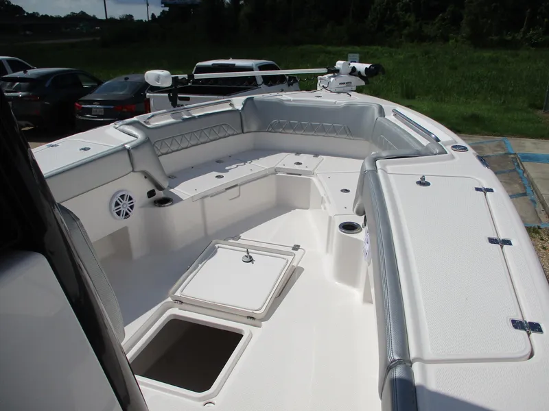 Slide: The Image of 2024 Blue Wave 2800 Makaira boat interior with seating and storage compartments. - 26