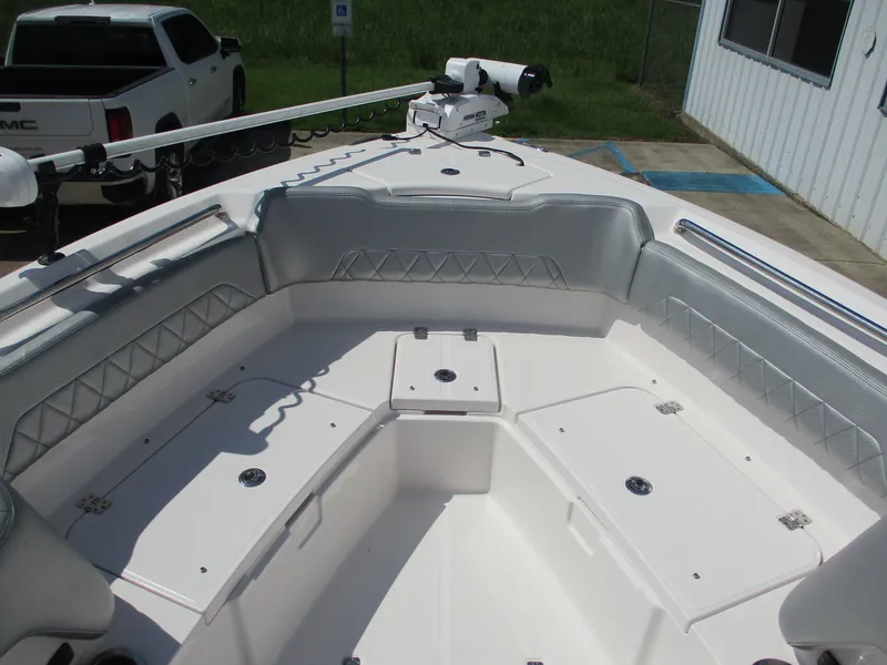 Slide: The Image of 2024 Blue Wave 2800 Makaira boat interior with seating and storage compartments. - 29