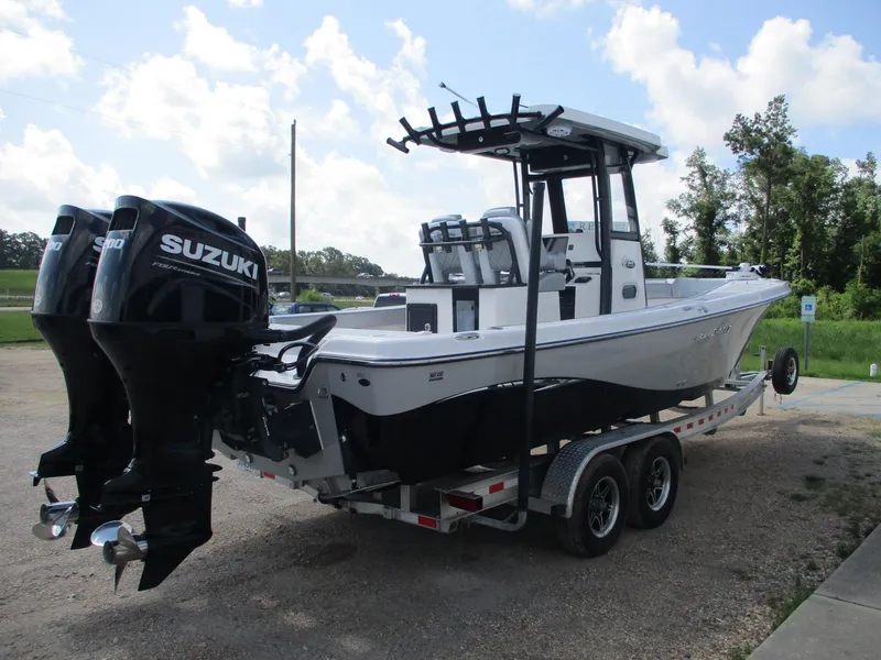 Slide: The Image of 2024 Blue Wave 2800 Makaira boat with dual Suzuki engines on a trailer. - 3