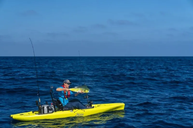 The Image of Man fishing on 2025 Hobie Mirage Outback kayak in open ocean. - 0