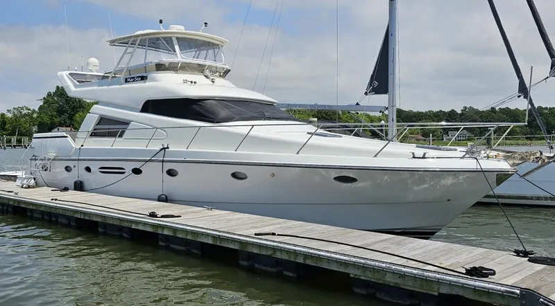 The Image of Luxury 1994 Johnson High Tech Euro 56 yacht docked at marina. - 0