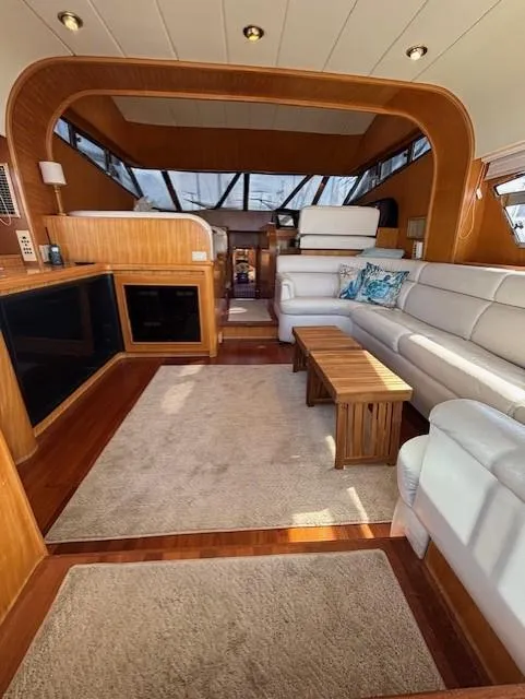 The Image of Luxurious interior of a 1994 Johnson High Tech Euro 56 yacht with elegant wood and leather furnishings. - 1
