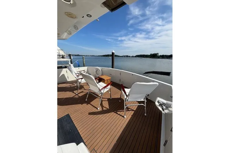Slide: The Image of Deck view of 1994 Johnson High Tech Euro 56 yacht with chairs overlooking water. - 15