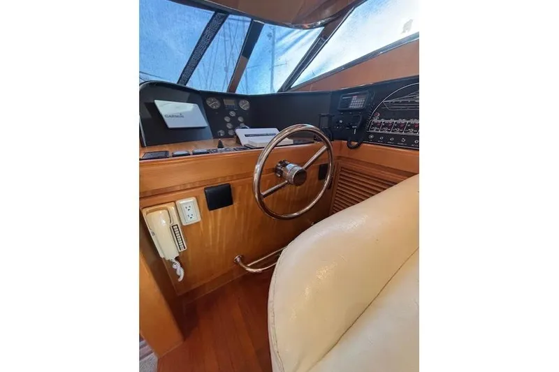 Slide: The Image of Interior of a 1994 Johnson High Tech Euro 56 yacht cockpit with steering wheel and controls. - 20