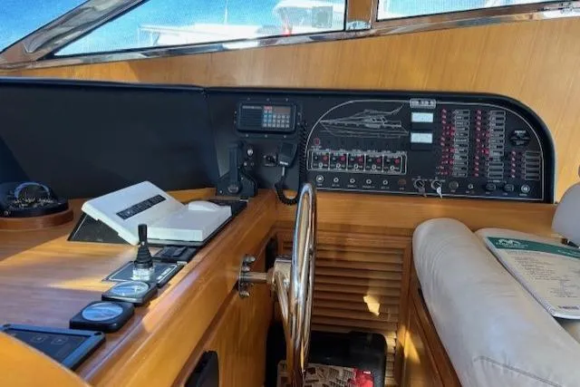 Slide: The Image of Cockpit of 1994 Johnson High Tech Euro 56 yacht with control panel and steering wheel. - 25