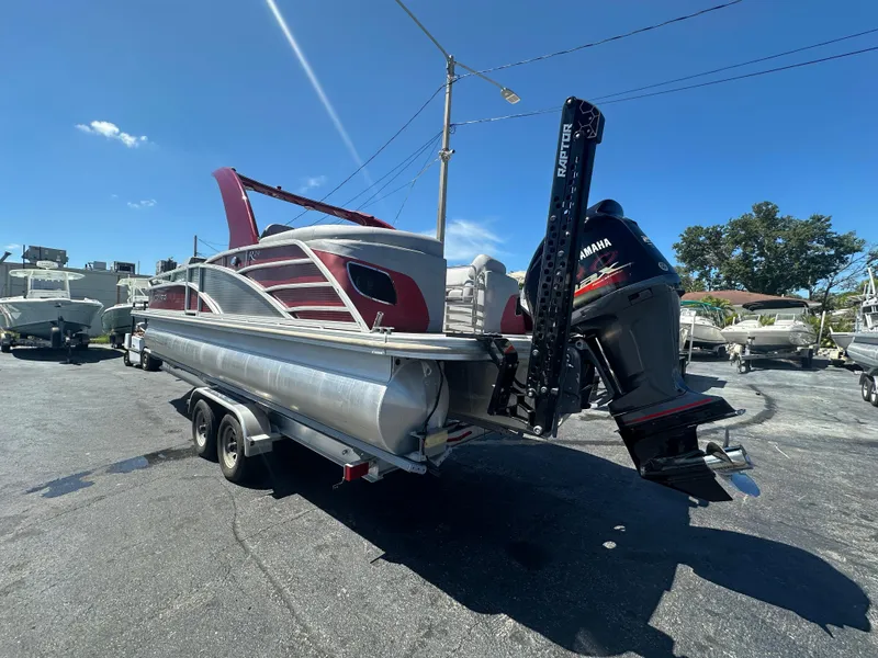 Slide: The Image of 2020 Bennington R 24 RTFBA pontoon boat with Yamaha motor on trailer. - 11