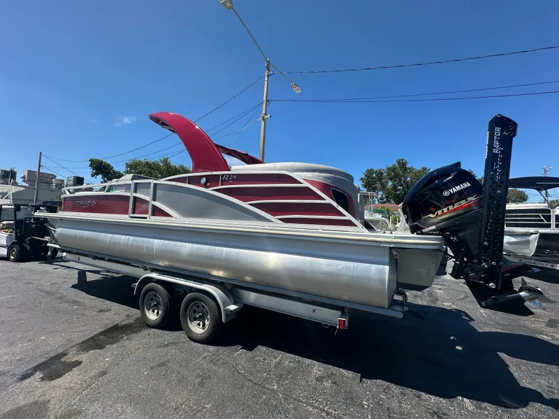 Slide: The Image of 2020 Bennington R 24 RTFBA pontoon boat on trailer, featuring Yamaha outboard motor. - 12
