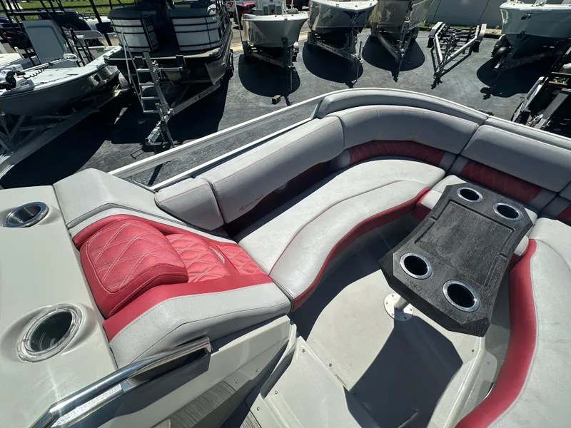 Slide: The Image of 2020 Bennington R 24 RTFBA boat interior with red and gray seating and cup holders. - 19