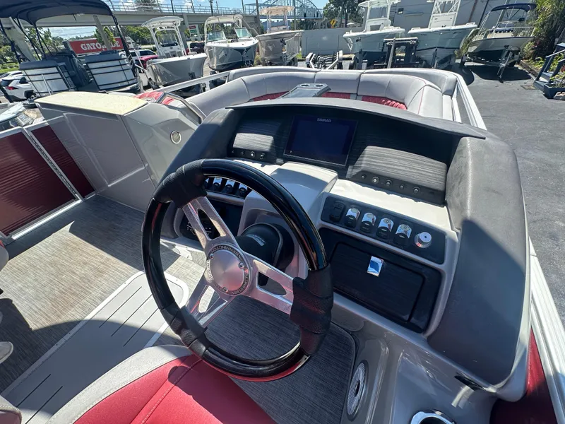 Slide: The Image of 2020 Bennington R 24 RTFBA boat dashboard with steering wheel and controls. - 29