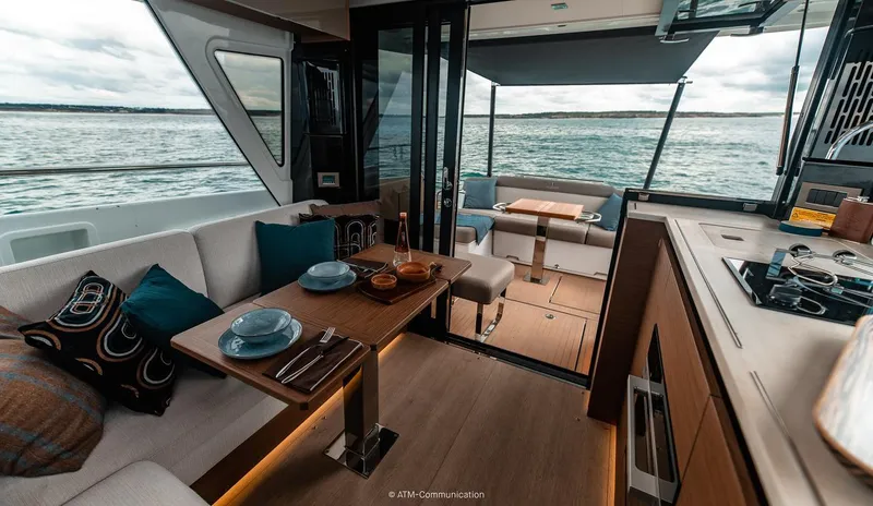 Slide: The Image of Luxurious interior of 2026 Wellcraft 44 Explorer yacht with dining area and ocean view. - 5