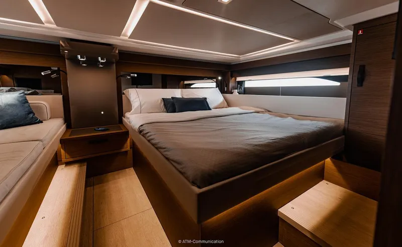 Slide: The Image of Luxurious cabin interior of 2026 Wellcraft 44 Explorer yacht with modern bedding and lighting. - 9