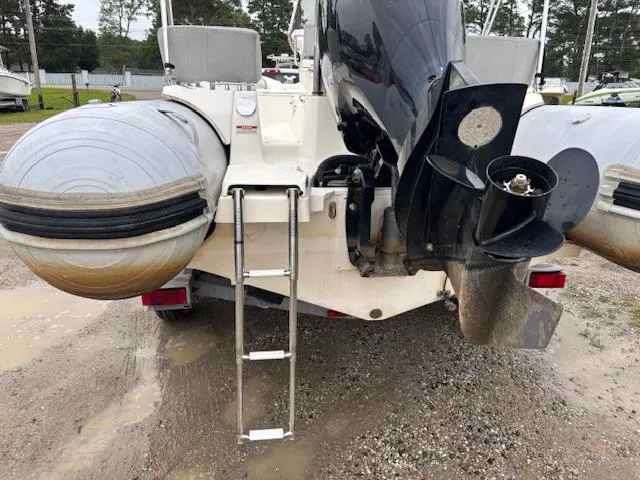 Slide: The Image of 2023 Zodiac NZO-680 inflatable boat rear view with ladder and outboard motor. - 10