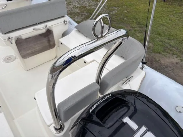 Slide: The Image of 2023 Zodiac NZO-680 boat interior with Mercury engine and seating. - 11