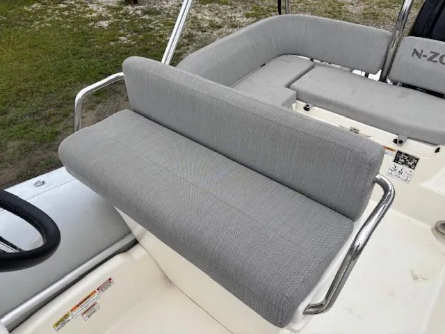Slide: The Image of 2023 Zodiac NZO-680 boat seating with gray upholstery and stainless steel rails. - 14