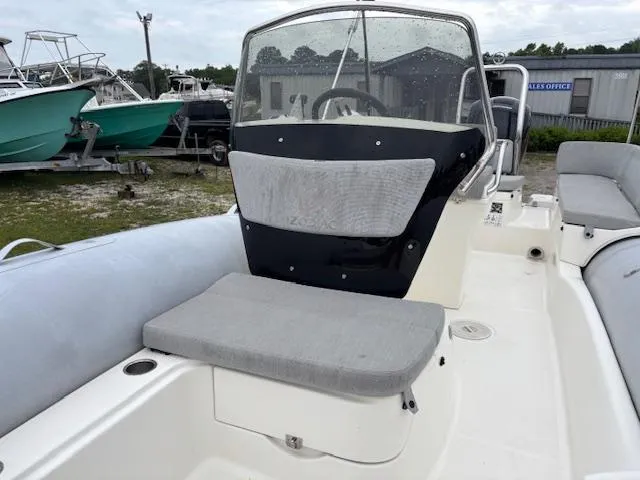 Slide: The Image of 2023 Zodiac NZO-680 boat interior with seating and steering console. - 16