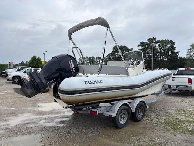 Slide: The Image of 2023 Zodiac NZO-680 inflatable boat on trailer, parked outdoors. - 5