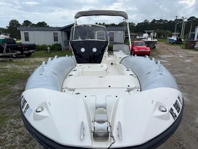 Slide: The Image of 2023 Zodiac NZO-680 inflatable boat in a yard, featuring a sleek design and spacious deck. - 9