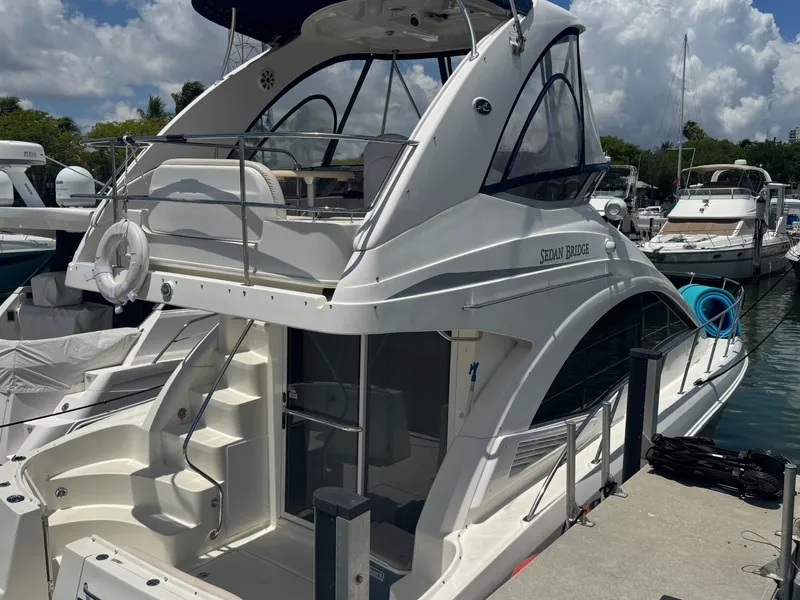 Slide: The Image of 2007 Sea Ray 360 Sedan yacht docked at marina under cloudy sky. - 11