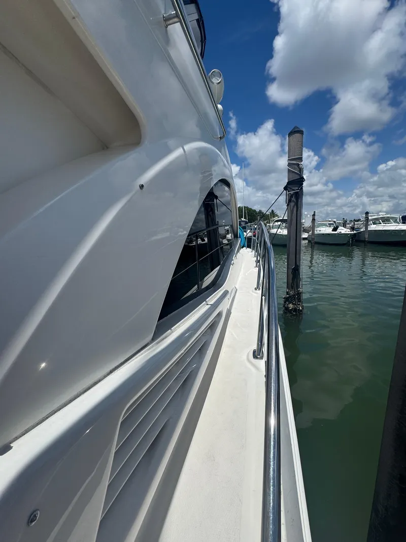 Slide: The Image of 2007 Sea Ray 360 Sedan yacht docked at marina under blue sky. - 15