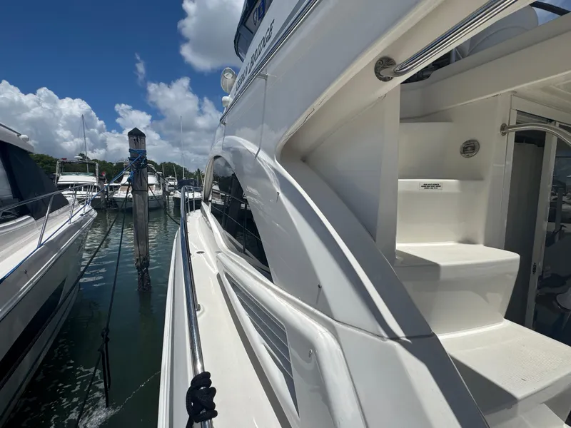 Slide: The Image of 2007 Sea Ray 360 Sedan yacht docked at marina under clear blue sky. - 18