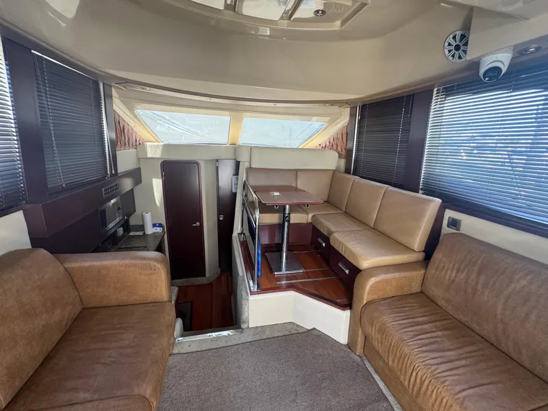 Slide: The Image of Interior of 2007 Sea Ray 360 Sedan with leather seating and dining area. - 19