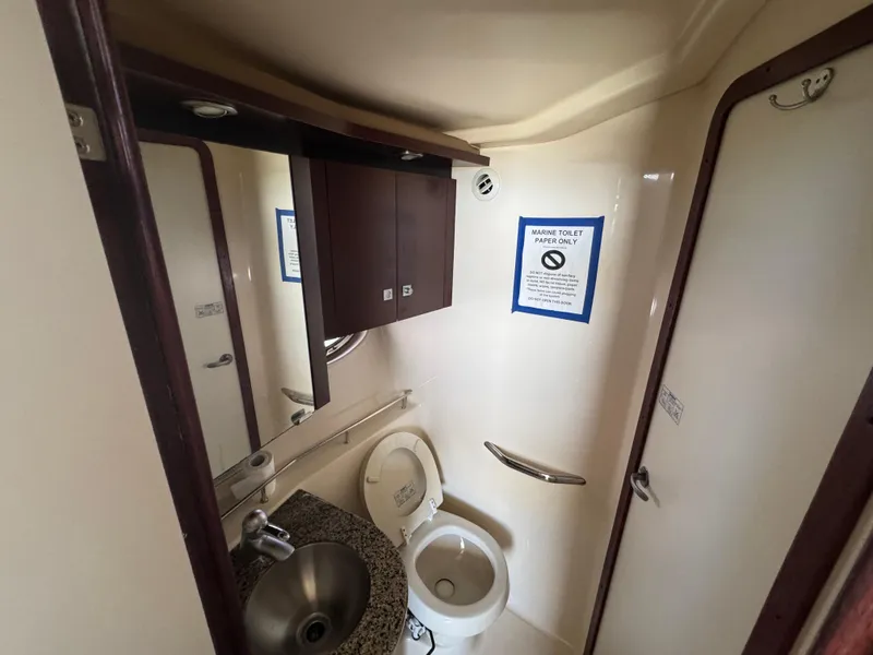 Slide: The Image of Bathroom interior of 2007 Sea Ray 360 Sedan with marine toilet and sink. - 37