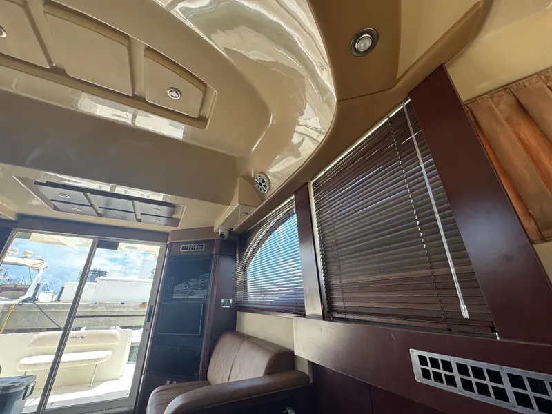 Slide: The Image of Interior of 2007 Sea Ray 360 Sedan with modern design and wooden blinds. - 39