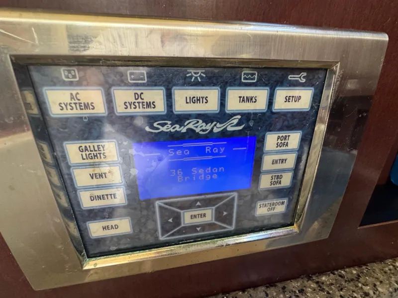 Slide: The Image of Control panel of a 2007 Sea Ray 360 Sedan yacht with various system buttons. - 40
