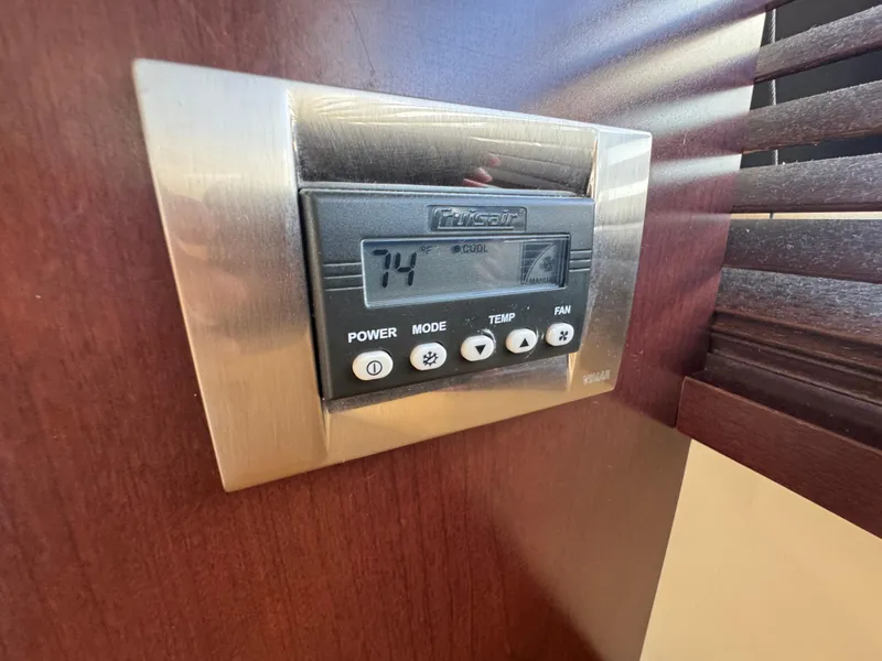Slide: The Image of Thermostat control panel on 2007 Sea Ray 360 Sedan yacht, displaying 74°F temperature setting. - 41