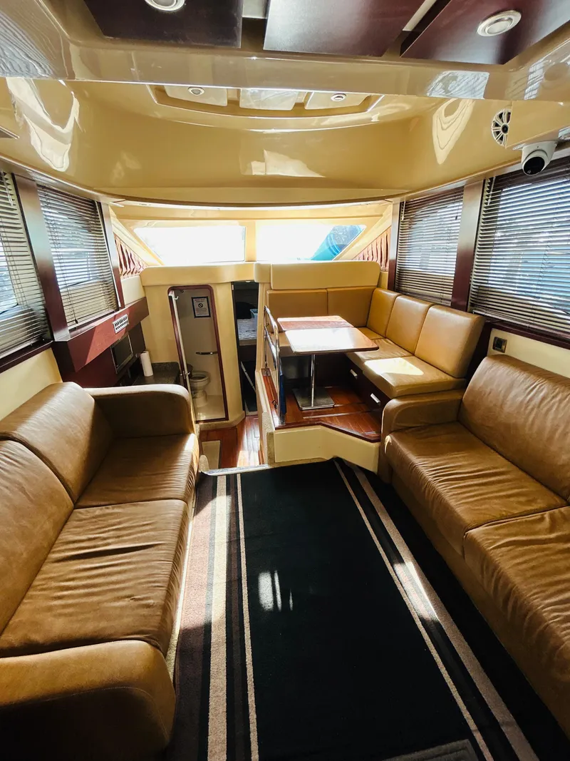 Slide: The Image of Luxurious interior of a 2007 Sea Ray 360 Sedan with leather seating and dining area. - 6