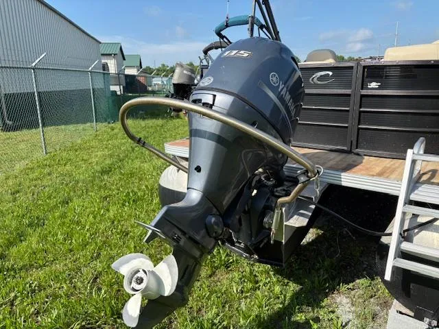 Slide: The Image of 2018 Crest I 220 SLC boat with Yamaha 115 outboard motor on grass. - 11