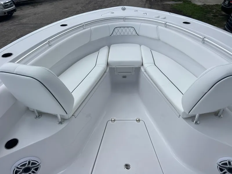 Slide: The Image of 2025 Sportsman Open 262 Center Console boat with white seating and stainless steel railings. - 14
