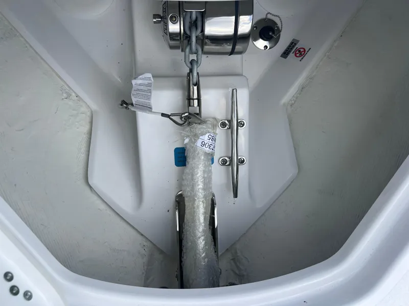 Slide: The Image of 2025 Sportsman Open 262 Center Console anchor compartment with chain and cleat. - 15