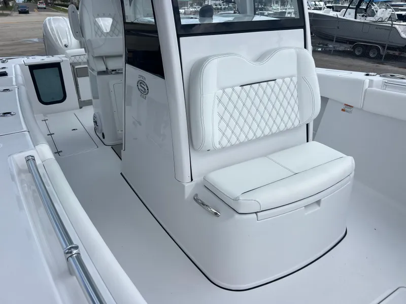 Slide: The Image of 2025 Sportsman Open 262 Center Console boat interior with white seating and sleek design. - 18
