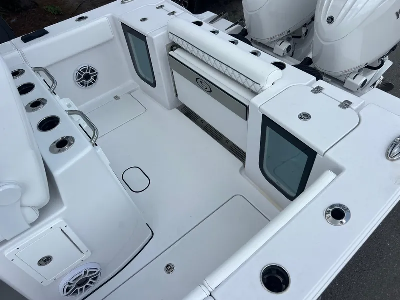 Slide: The Image of 2025 Sportsman Open 262 Center Console boat interior with seating and storage compartments. - 20