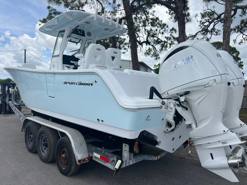 Slide: The Image of 2025 Sportsman Open 262 Center Console boat on trailer with Yamaha engines. - 4