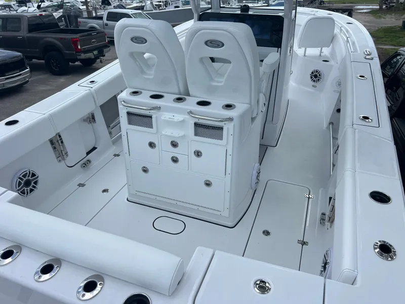 Slide: The Image of 2025 Sportsman Open 262 Center Console boat interior with seating and storage compartments. - 6