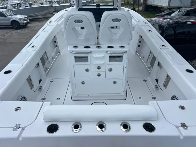 Slide: The Image of 2025 Sportsman Open 262 Center Console boat interior with seating and storage compartments. - 8