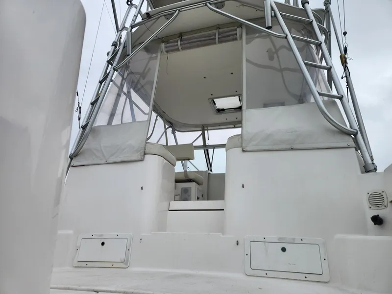 Slide: The Image of 2003 Luhrs 30 Open boat cockpit with ladder and seating area. - 10