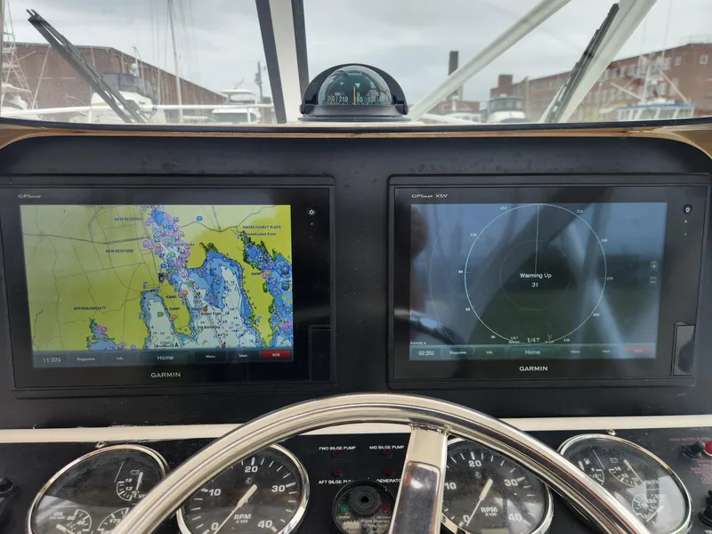 Slide: The Image of Dashboard of 2003 Luhrs 30 Open boat with Garmin navigation displays. - 14