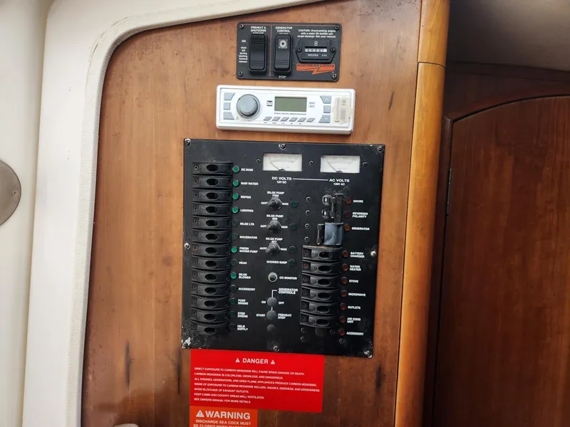 Slide: The Image of Electrical control panel on a 2003 Luhrs 30 Open boat interior. - 17