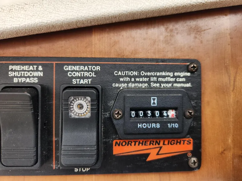 Slide: The Image of Control panel of a 2003 Luhrs 30 Open boat with generator hour meter. - 18
