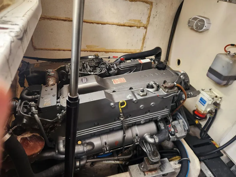 Slide: The Image of Engine compartment of a 2003 Luhrs 30 Open boat, showcasing detailed machinery. - 23